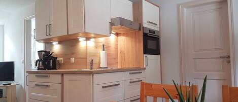 Fridge, microwave, oven, high chair