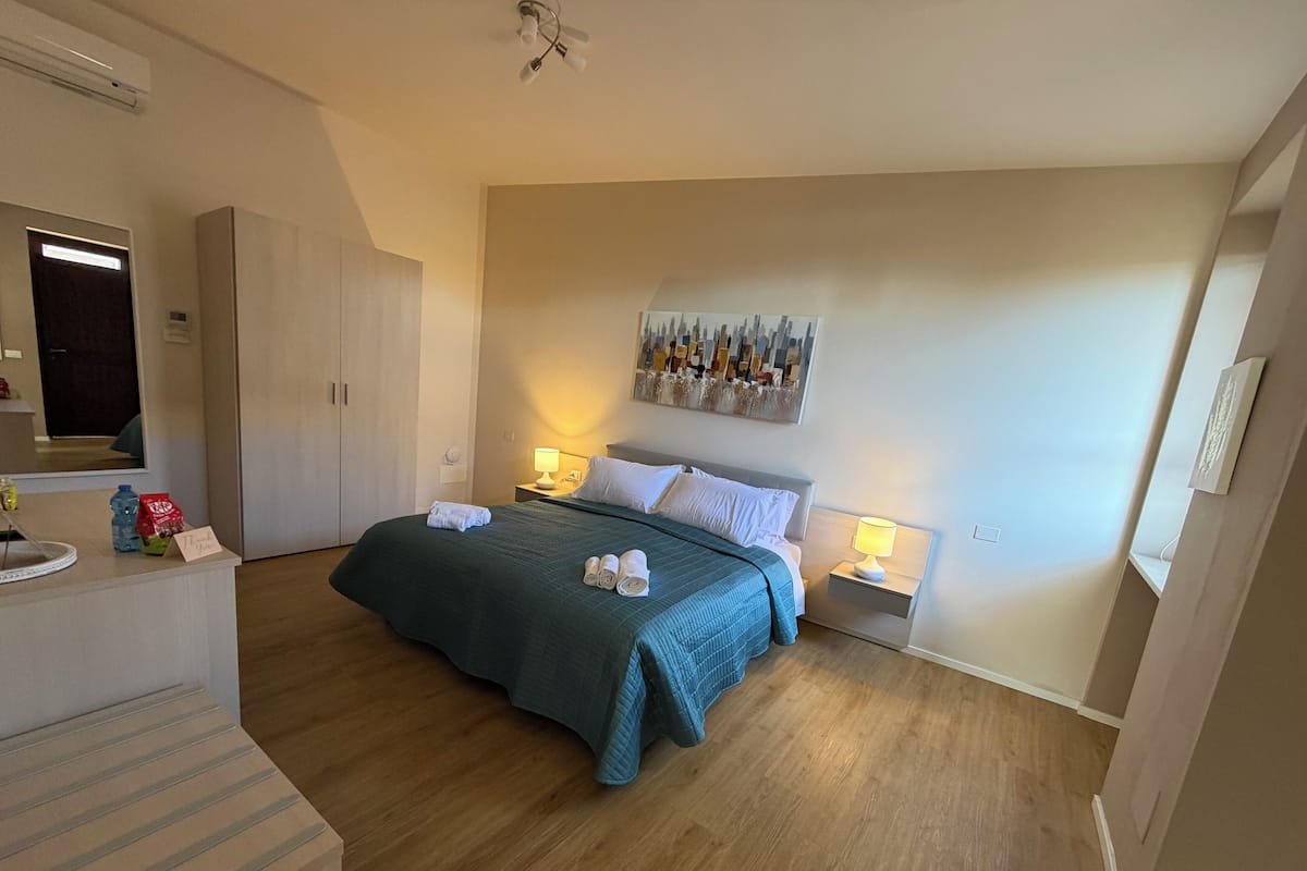 Family Quadruple Room | Desk, blackout drapes, free WiFi, bed sheets