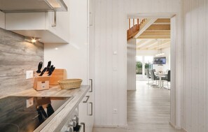 Fridge, stovetop, dishwasher, coffee/tea maker