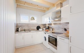 Fridge, stovetop, dishwasher, coffee/tea maker