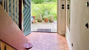 A staircase leading to a door with a view of a garden. - Small castle Lanke (Lanke)