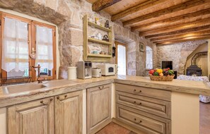 Fridge, stovetop, dishwasher, coffee/tea maker