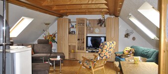 idyllic, sunny apartment at the natural swimming pond and with a fireplace