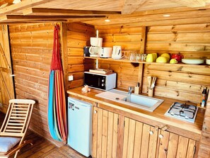 Fridge, microwave, stovetop, coffee/tea maker