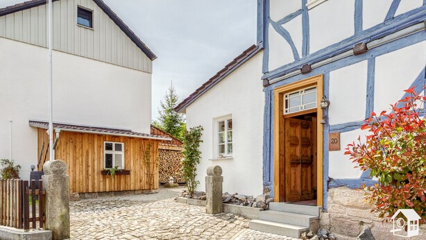 A traditional half-timbered house with a stone pathway leading to the entrance. - Vacation in a monument; Relax in the Geo-Naturpark Frau-Holle-Land, 4 DTV * (Berkatal-Hitzerode)