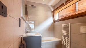 A compact bathroom with a shower, a sink, and a toilet. - K-Terra 4 : Recent and modern chalet with hot tub (MONTRIOND)