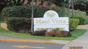 A sign for 'Maui Vista' with a butterfly logo, located at 2191 South King Road. - Maui Vista -  Fully Renovated, New Kitchen and Bathroom.  Best Location. (Kihei)