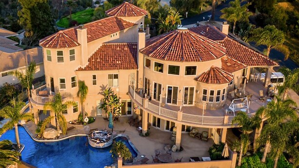 A large, multi-story house with a swimming pool, multiple balconies, and a landscaped garden. - 10,000 ft² view estate with 7 Bdm Suites, Resort Pool, Theatre, Gym, Game Room! (Fallbrook)