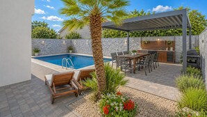 A swimming pool, outdoor seating, a pergola, and a barbecue area. - Gorgeous home in Vrsi Mulo with sauna (Vrsi Mulo)