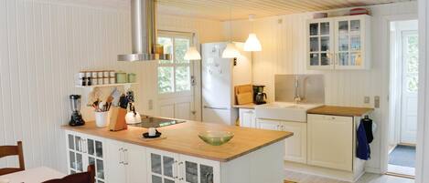 Fridge, stovetop, dishwasher, coffee/tea maker