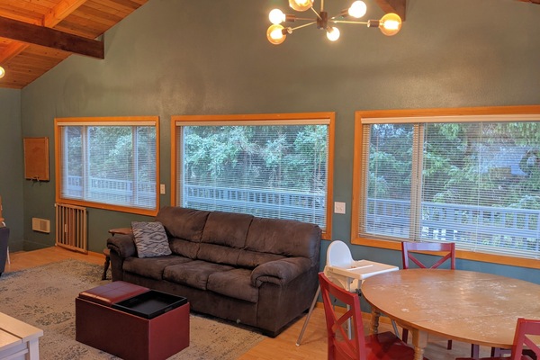 Living/Dining room with mature trees in back yard for privacy