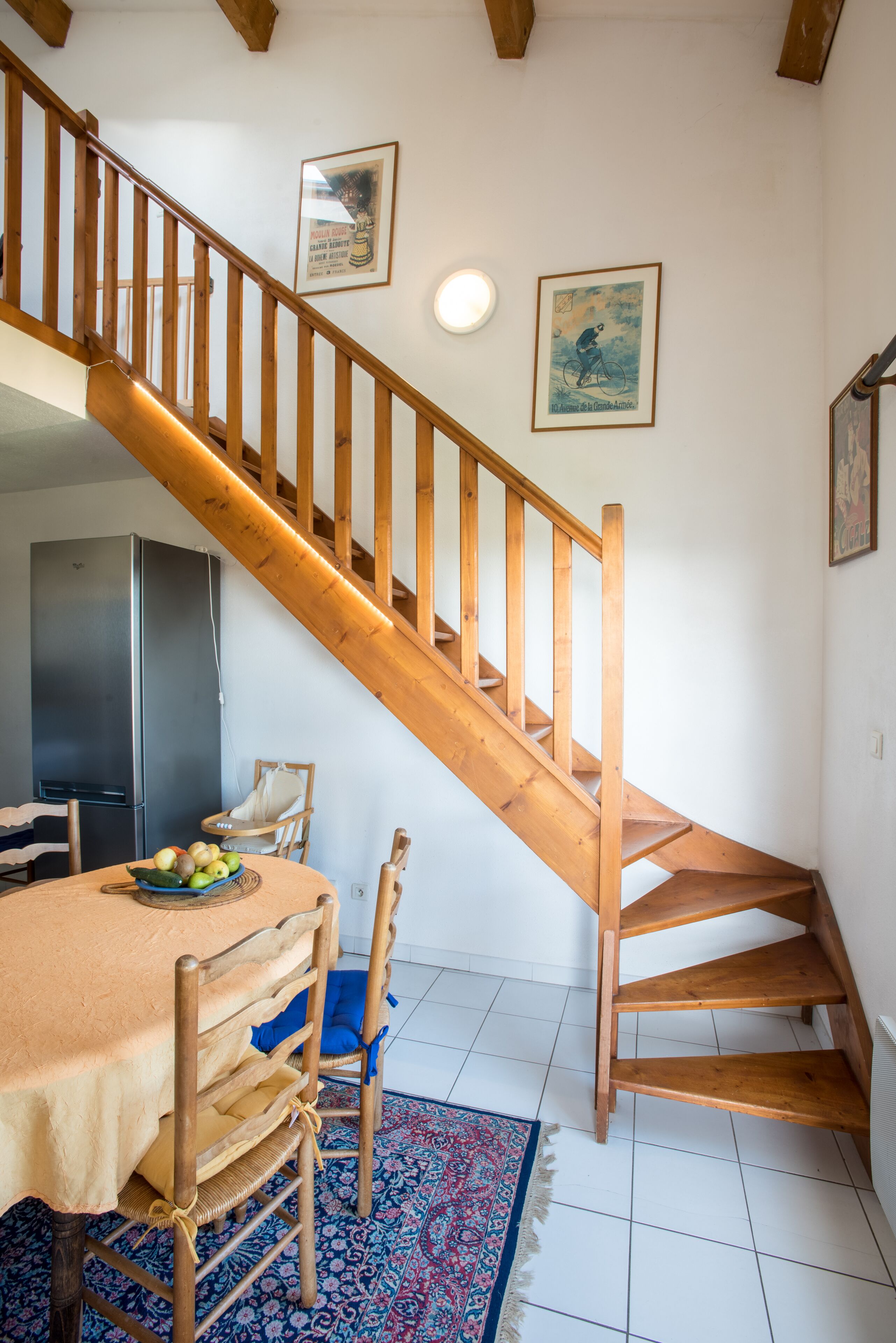 A staircase with wooden railings leading to a lower level.