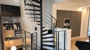 A modern kitchen with a built-in oven and a white refrigerator. - DUPLEX IN BEAUTIFUL TOUQUETTOISE, PROX. SHOPS & ST. JEAN STREET, 150M SEA FRONT (Le Touquet-Paris-Plage)