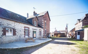 Stroll through a charming, historic neighborhood lined with unique brick houses and lush gardens.