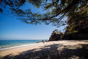 On the beach, sun loungers, beach towels