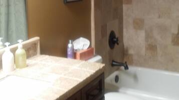 Shower, hair dryer, towels, shampoo