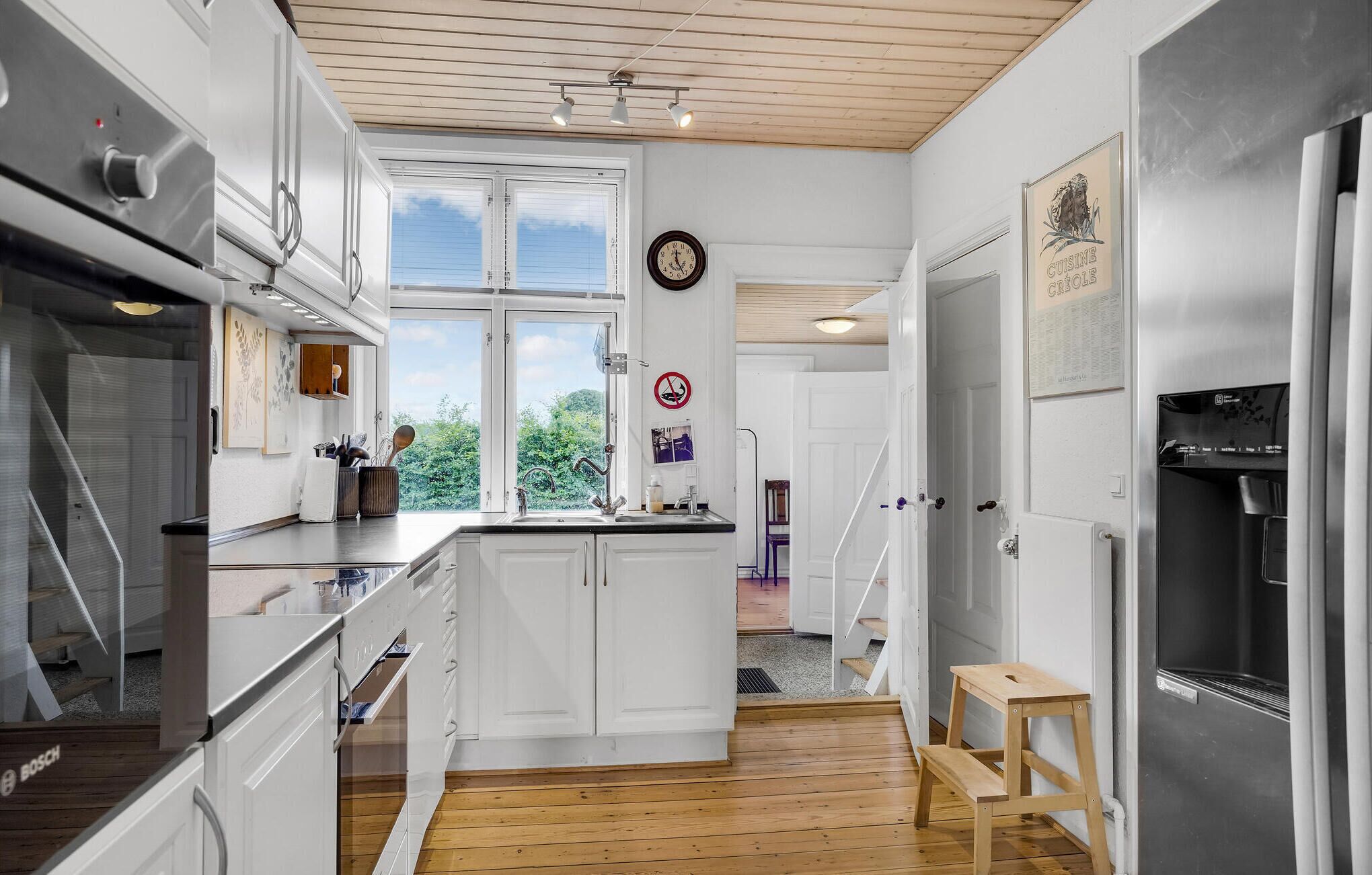 Fridge, stovetop, dishwasher, coffee/tea maker