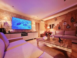 Smart TV, fireplace, table football, stereo