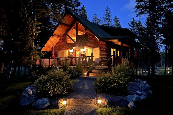 Welcome to your private Montana retreat -- warm light spills from every window as you arrive under a canopy of stars.