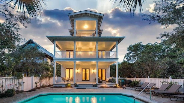 A two-story house with a swimming pool, a covered patio, and a balcony. - Gulf Views-Private Heated Pool-5 bikes included! (Santa Rosa Beach)