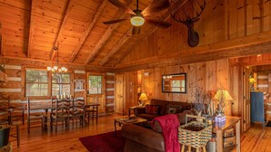 A log cabin interior with a dining area, a living room, and a kitchen. - Million $ View: Hot Tub | Theater Room | Pool Table | Air Hockey | 10min to Banner Elk (Banner Elk)