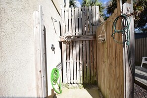 Enter a serene outdoor space through this charming gate, leading to a lush garden oasis.