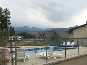 Outdoor pool - Cozy Top Floor End Unit with Mountain Views of Byers Peak and Winter Park Resort (Fraser)
