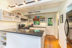 Kitchen island counter.  Hardwood floors throughout.