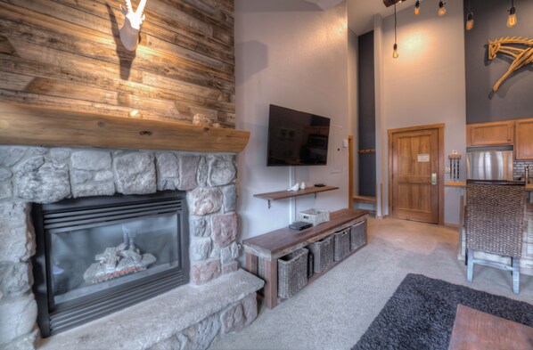 Smart TV, fireplace, table football, books