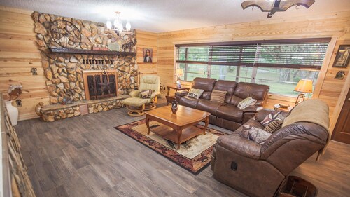 BEAUTIFUL RETREAT HOME ON 2 FENCED PRIVATE ACRES. WALK TO FOREST AND GOLF!