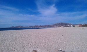 On the beach, sun loungers, beach towels