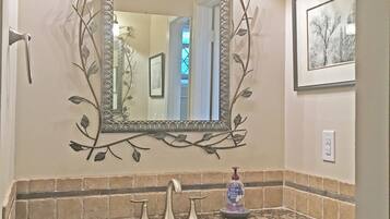 Bathtub, hair dryer, towels, soap
