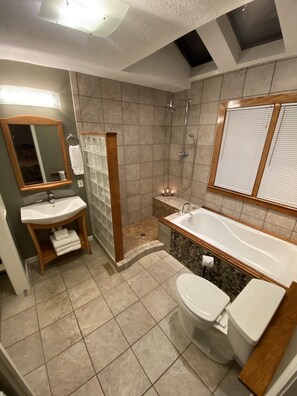 Bathtub, hair dryer, towels, soap