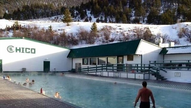 A swimming pool area with a building labeled "HICO" in the background. - 30 Miles from Yellowstone Park! View is Breathtaking! (Emigrant)