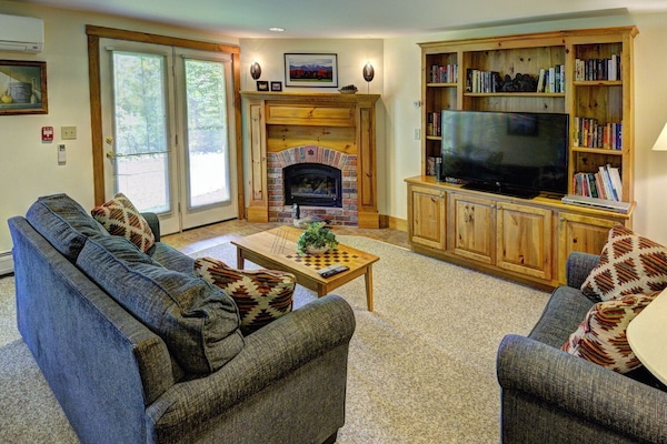 Cozy living area looks out on the woods and Granny Jay ski trail