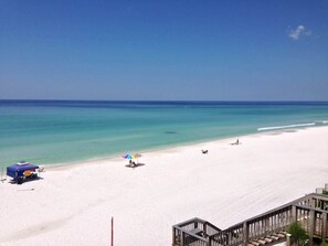 A beach with a clear sky, a sandy shore, and a few people. - Gulf Front - Beach Chairs* Endless Views (Santa Rosa Beach)