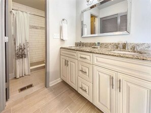 Bathtub, hair dryer, towels, soap
