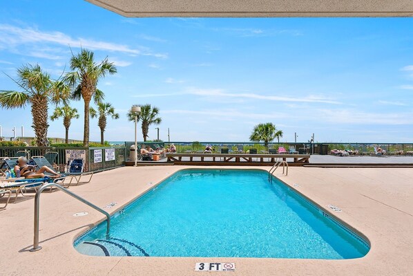 A swimming pool with a 3 FT no diving sign, surrounded by lounge chairs and palm trees. - 3rd Floor, Private Oceanfront Balcony, AshWorth, Sleeps 8 | Ashworth - 308 (North Myrtle Beach)