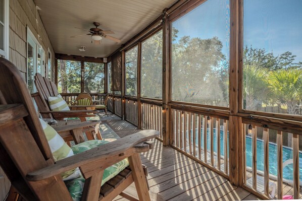Terrace/patio - Woodlands Wonder: Cute Oak Island Cottage with Private Pool Welcomes Nightly Res (Oak Island)
