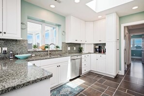 Oven, dishwasher, coffee/tea maker, cookware/dishes/utensils