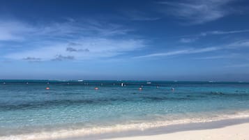 On the beach, sun-loungers, beach towels, beach bar