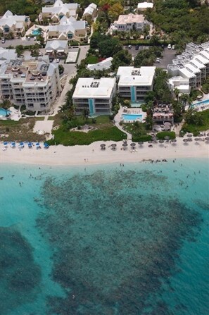 On the beach, sun loungers, beach towels, beach bar