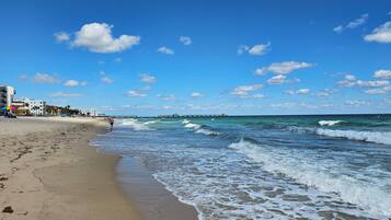 On the beach, sun loungers, beach towels