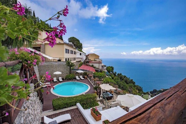 Outdoor pool, a heated pool, pool loungers