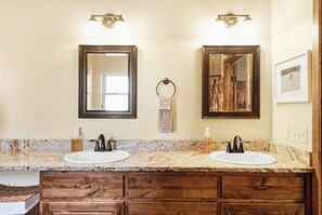 Combined shower/bathtub, towels, soap, shampoo