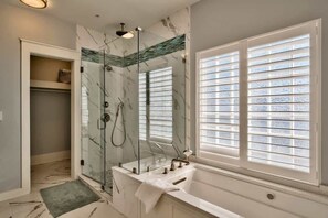 Bathtub, hair dryer, towels, soap