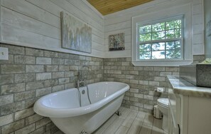 Bathtub, hair dryer, towels, soap