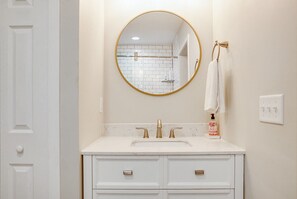 Combined shower/tub, hair dryer, towels, soap