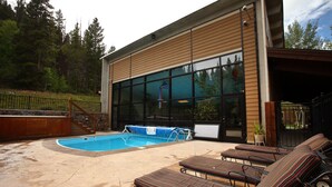 A pool area with lounge chairs and a hot tub. - Ski or Ride, Hike Or Bike This Is Your Paradise! (Breckenridge)