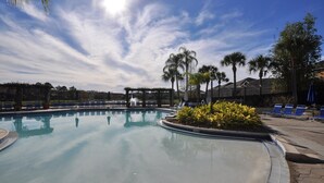 A swimming pool with lounge chairs and palm trees. - Special rates available in Sep and  Oct of 2026 (Kissimmee)